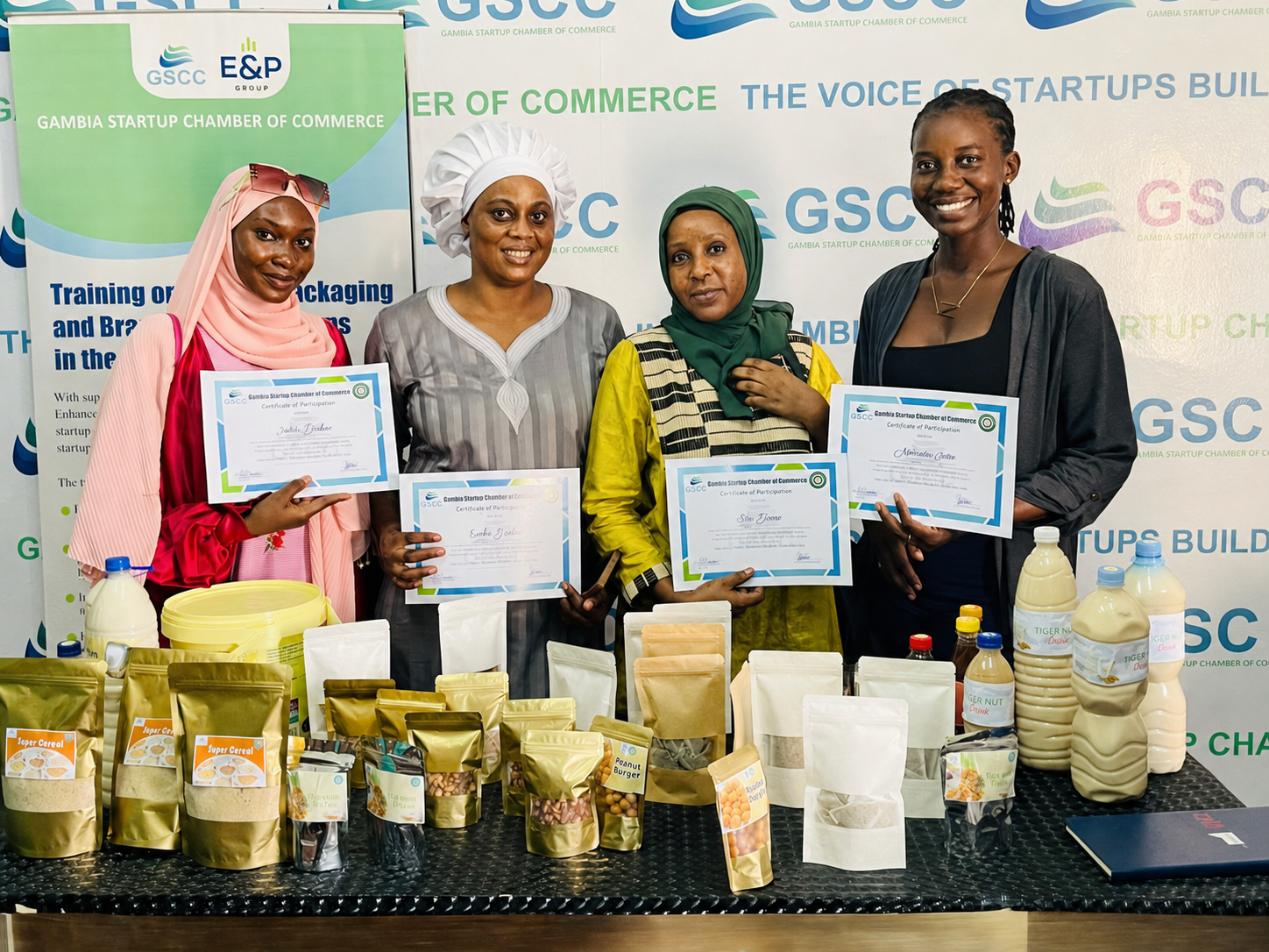 GSCC training participants displaying certificates and products