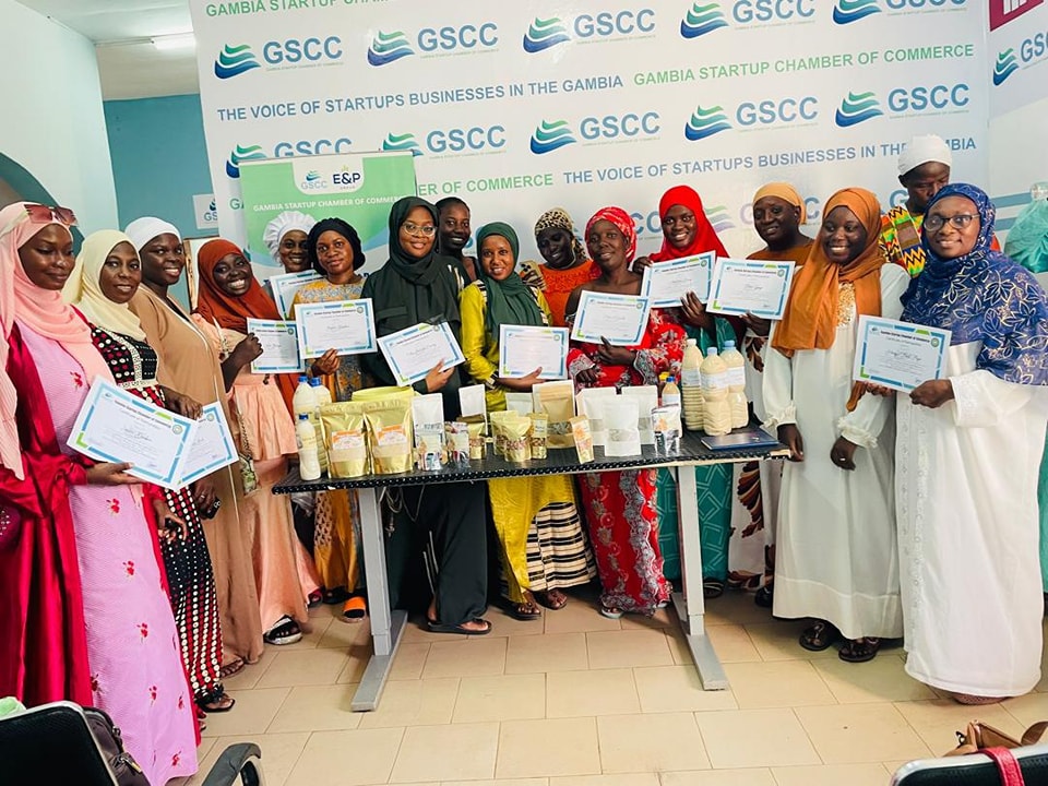 GSCC training participants displaying certificates and products